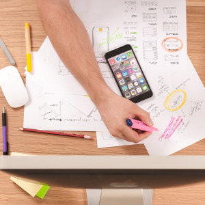 Image of a person writing on paper.